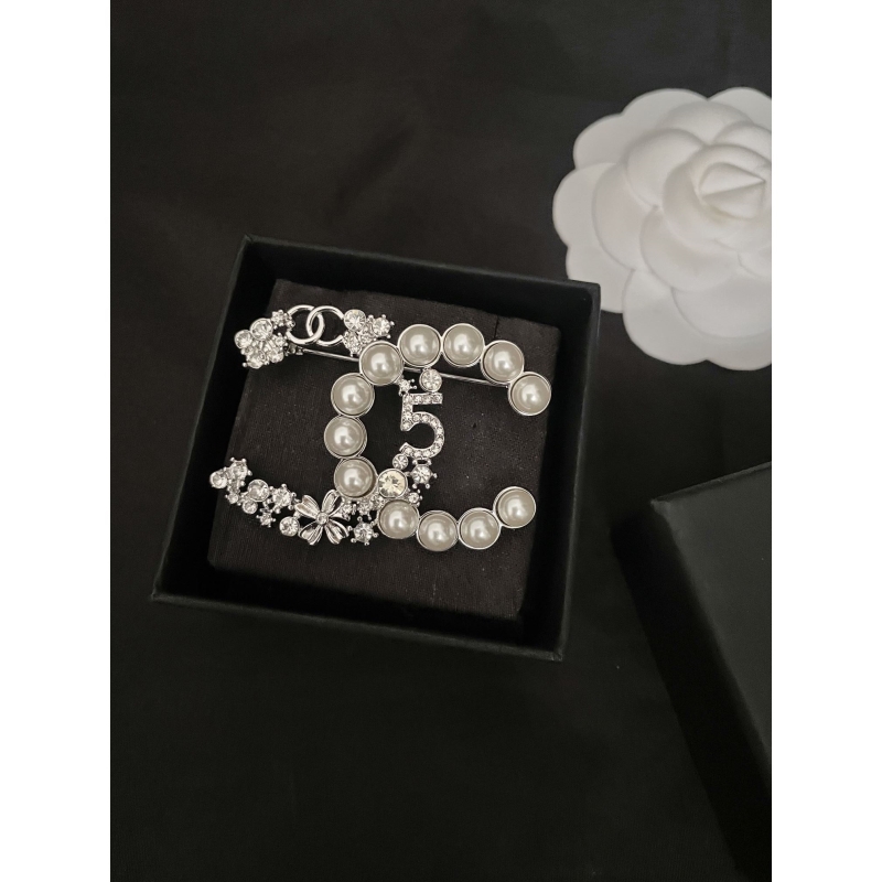Ch**el brooches